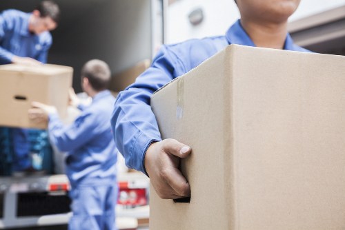 Commercial moving team organizing office equipment in Storage Kensington