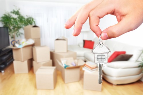 Professional movers handling furniture pick-up in Kensington storage facility