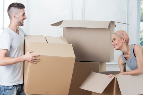 Efficient moving services team carefully packing belongings
